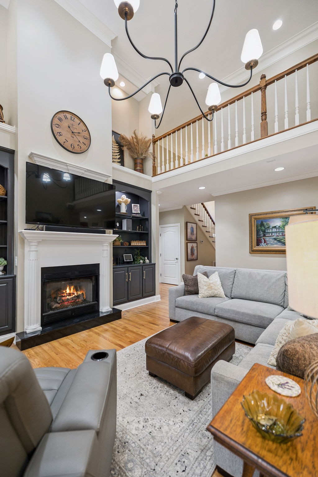 3056 Southeast Tater Peeler Road Lebanon, TN 37090 - Photo 26 of 100 a living room with furniture a flat screen tv and a fireplace