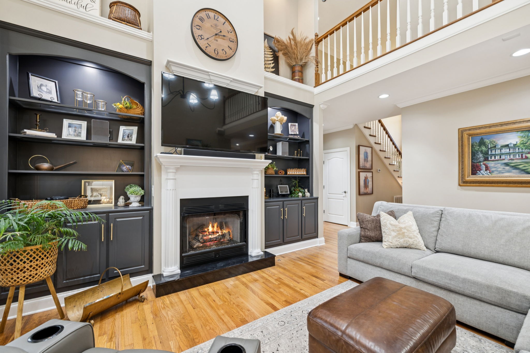 3056 Southeast Tater Peeler Road Lebanon, TN 37090 - Photo 27 of 100 a living room with furniture a flat screen tv and a fireplace