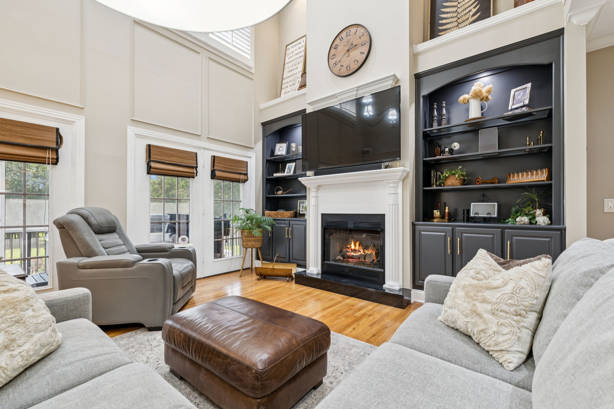 3056 Southeast Tater Peeler Road Lebanon, TN 37090 - Photo 31 of 100 a living room with furniture a flat screen tv and a fireplace