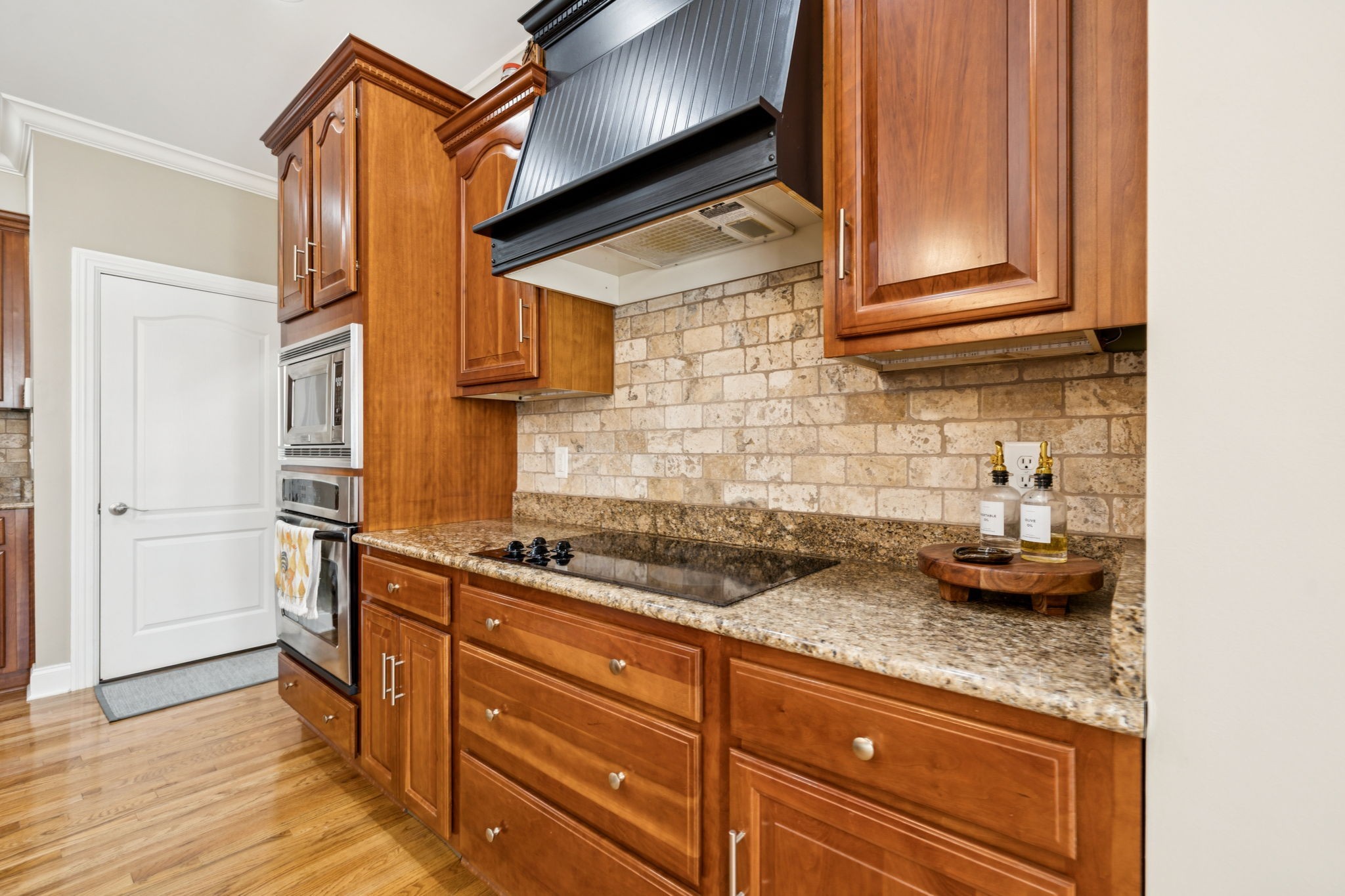 3056 Southeast Tater Peeler Road Lebanon, TN 37090 - Photo 38 of 100 a kitchen with stainless steel appliances granite countertop a sink and cabinets