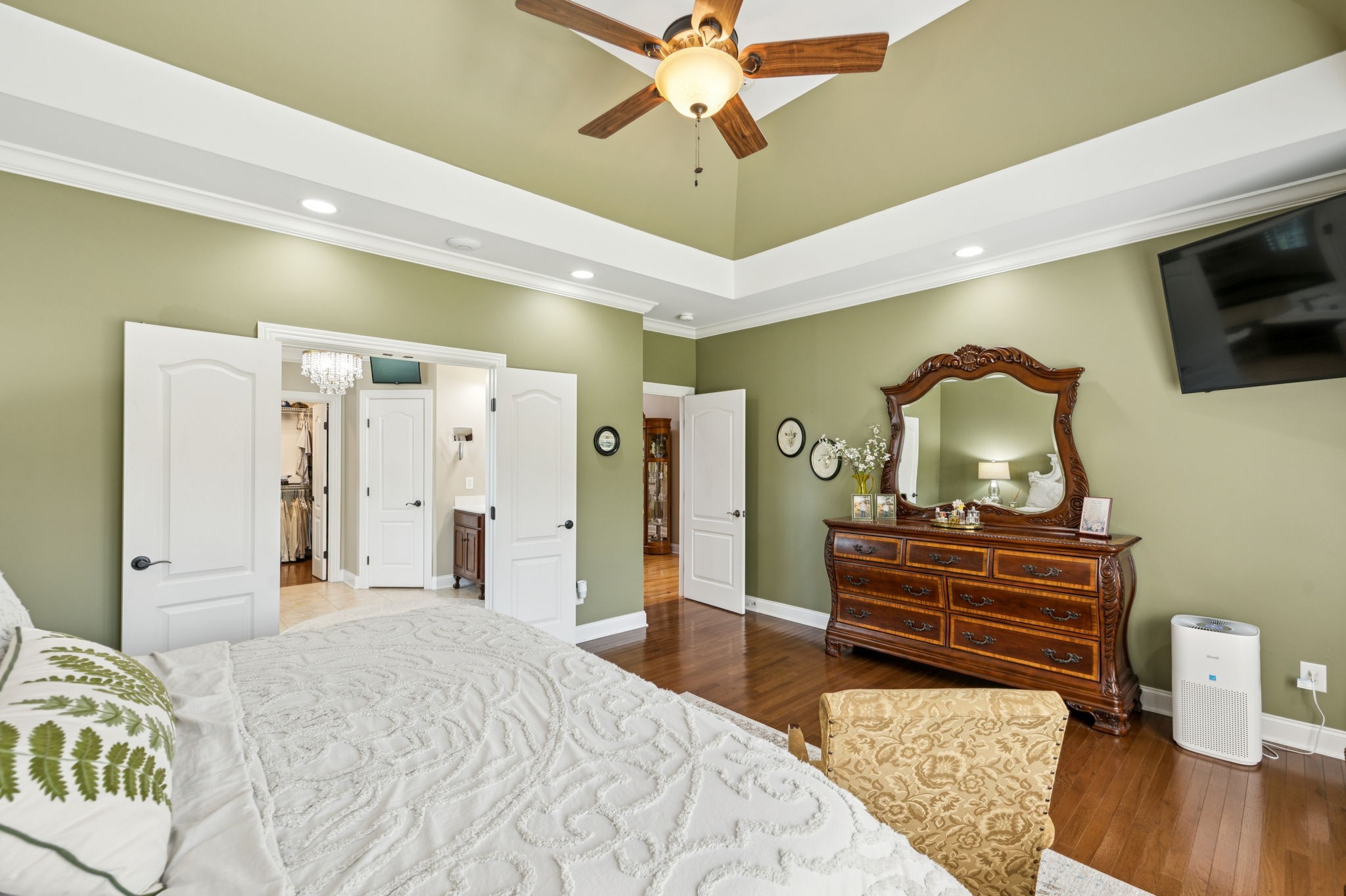 3056 Southeast Tater Peeler Road Lebanon, TN 37090 - Photo 46 of 100 a bedroom with a bed dresser and a flat screen tv