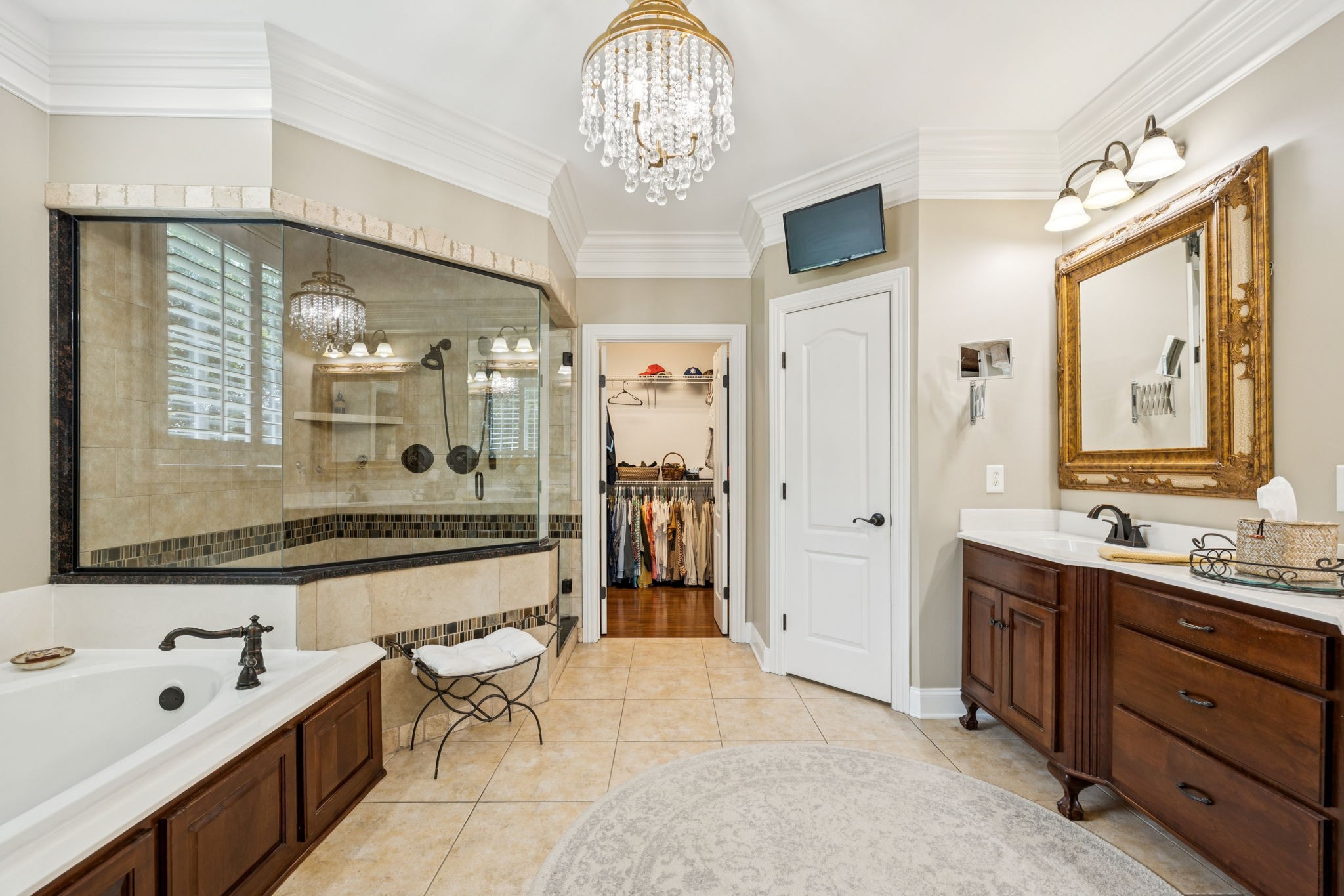 3056 Southeast Tater Peeler Road Lebanon, TN 37090 - Photo 48 of 100 a spacious bathroom with a double vanity sink a large mirror and a bathtub