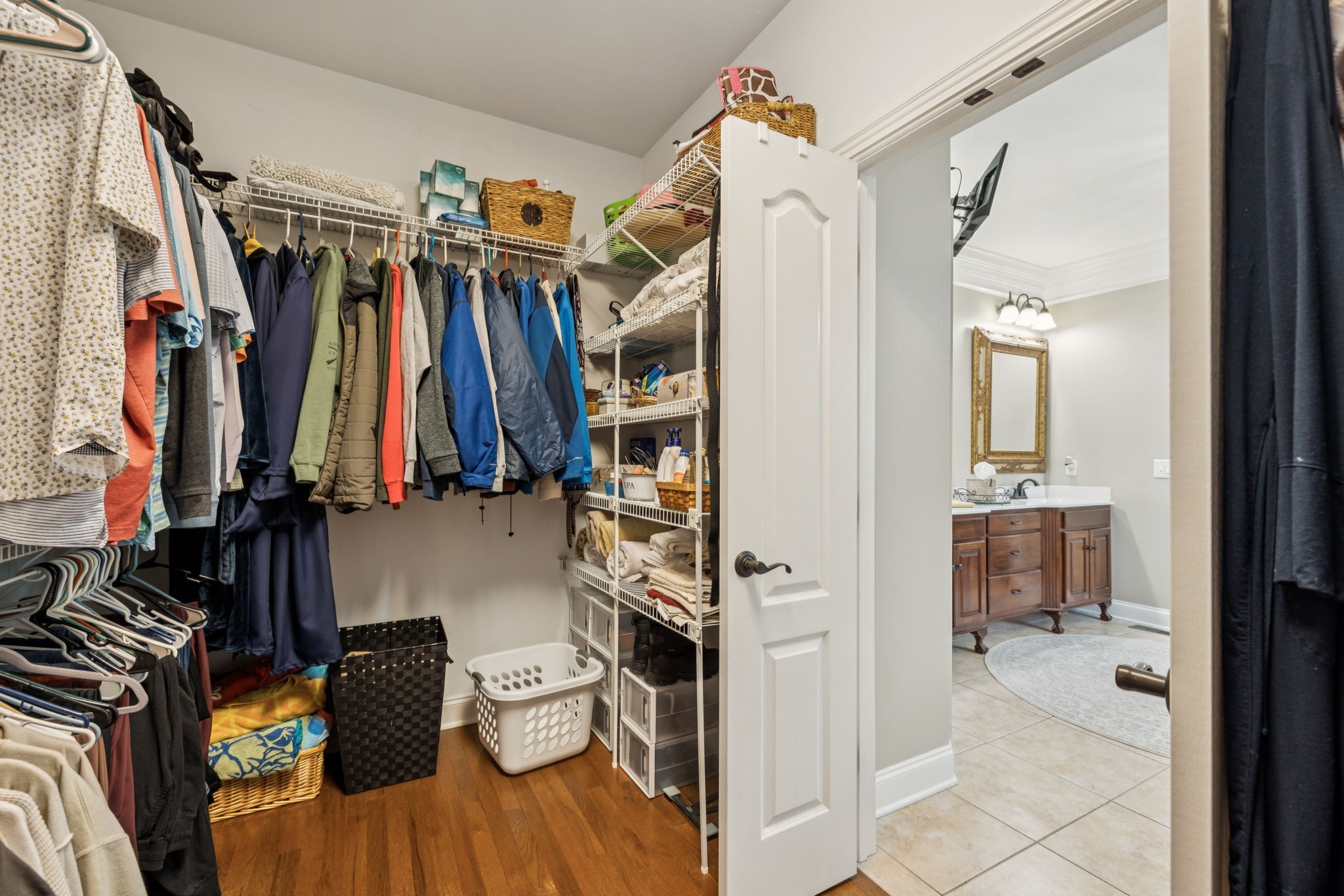3056 Southeast Tater Peeler Road Lebanon, TN 37090 - Photo 54 of 100 a view of walk in closet with clothes and shoes
