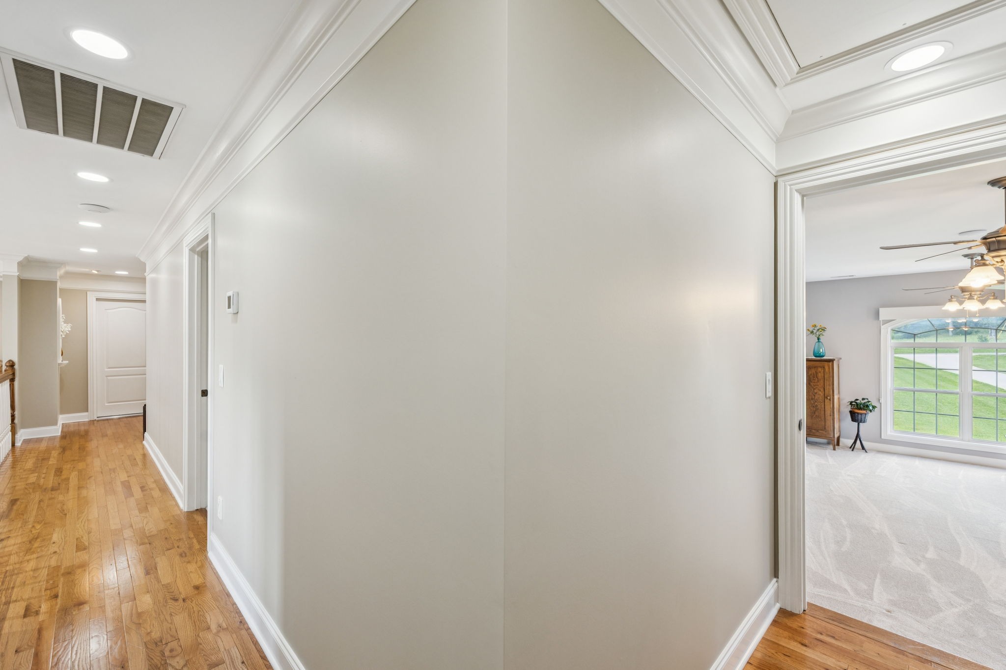 3056 Southeast Tater Peeler Road Lebanon, TN 37090 - Photo 72 of 100 a view of a hallway with wooden floor and a bathroom