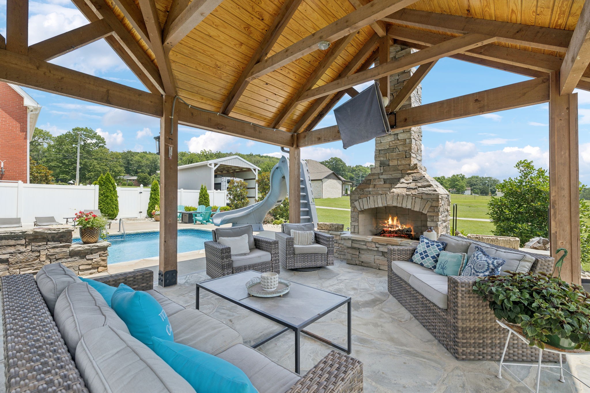 3056 Southeast Tater Peeler Road Lebanon, TN 37090 - Photo 87 of 100 a outdoor living space with patio furniture and a fireplace