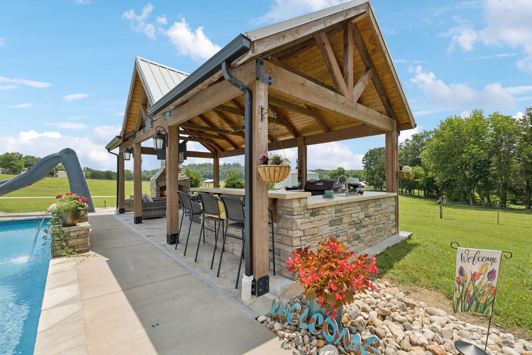 3056 Southeast Tater Peeler Road Lebanon, TN 37090 - Photo 90 of 100 a view of a patio with table and chairs potted plants with wooden floor