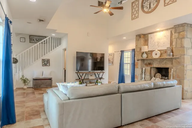 a living room with furniture and a fireplace