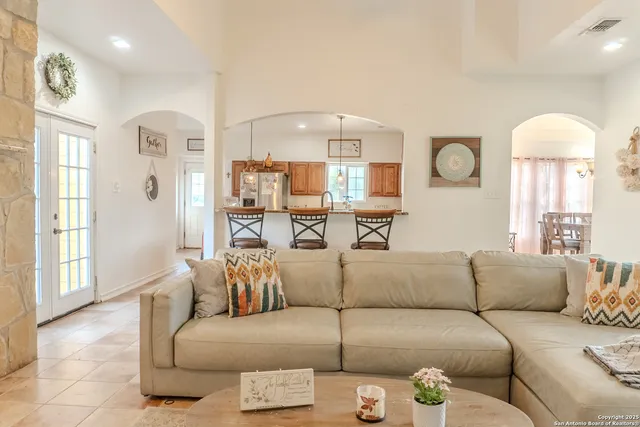 a living room with furniture and a large window