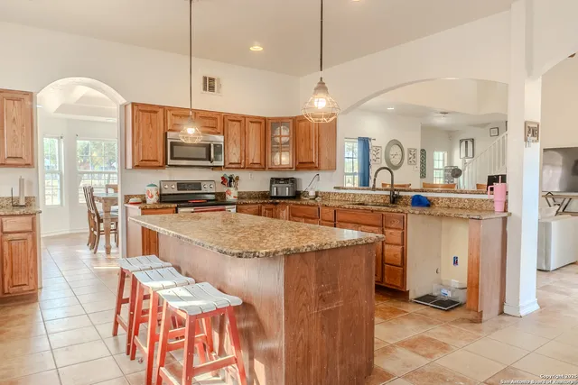 a large kitchen with lots of counter space and appliances