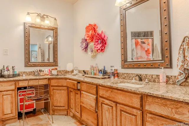 a bathroom with a sink and a mirror