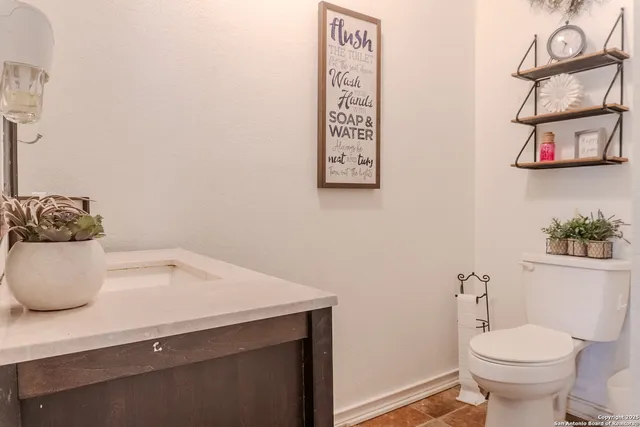 a bathroom with a sink and a toilet