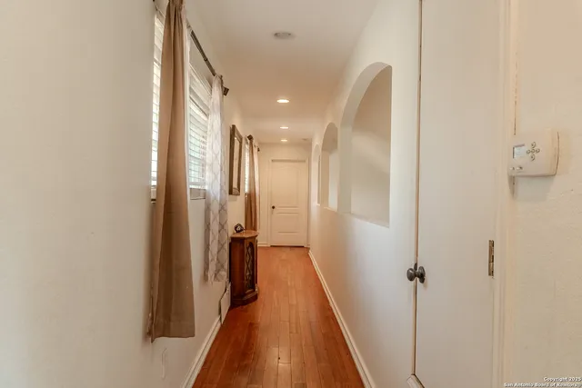 a view of a hallway with a white walls