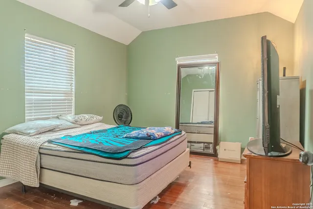 a bedroom with a bed and a table in it