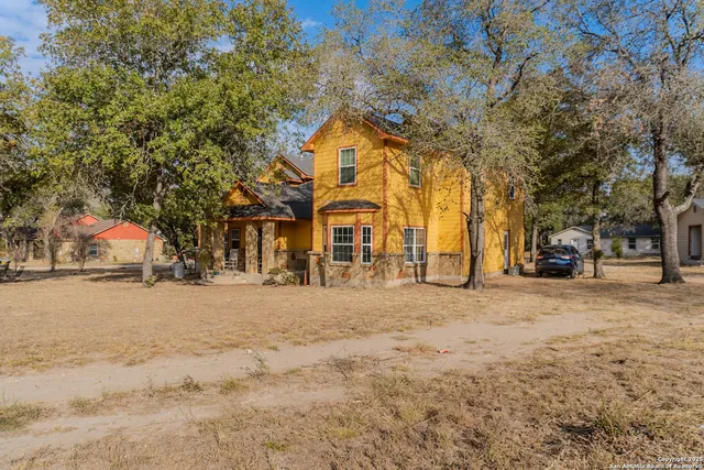 a front view of house with a yard