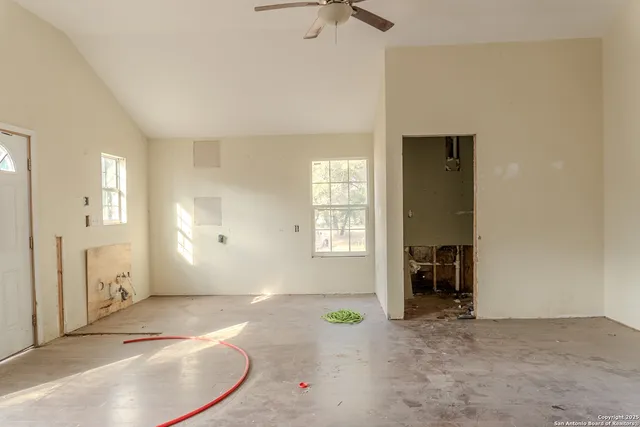 wooden floor with windows and a wooden vanity