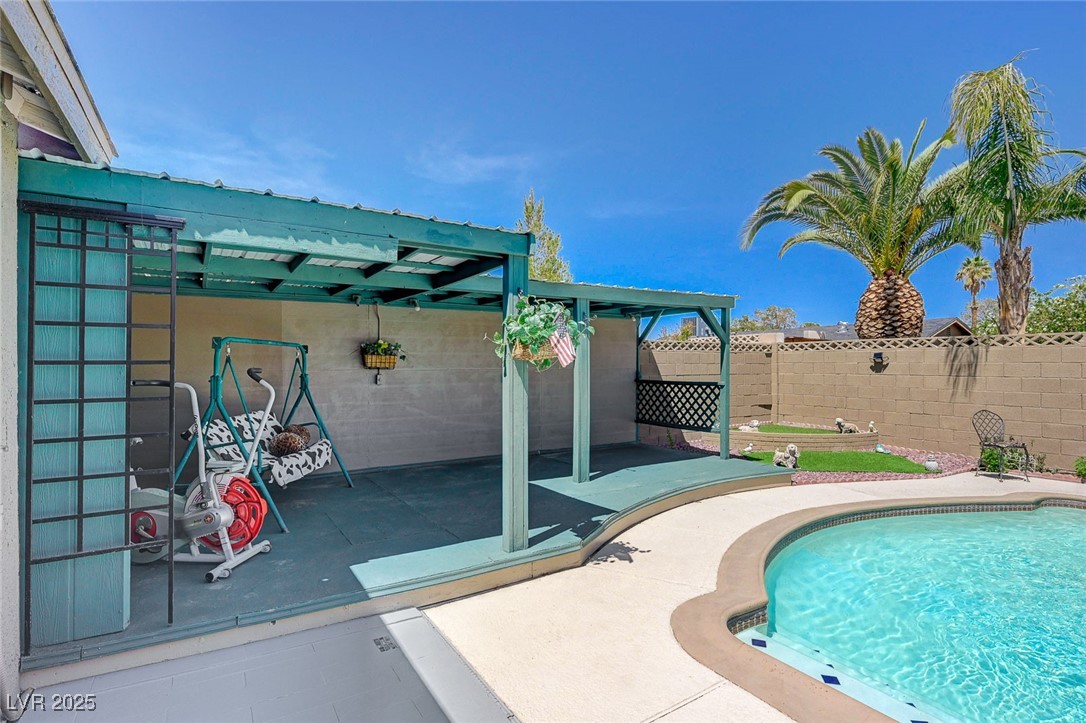 3266 Mountain Spring Road Las Vegas, NV 89146 - Photo 46 of 49 View of pool featuring fence, a fenced in pool, and a patio