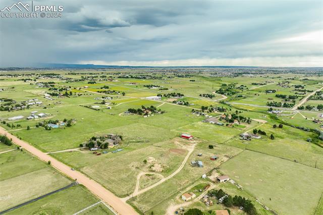 12550 Smith Road Peyton, CO 80831 - Photo 31 of 35 Birds eye view of property featuring a rural view