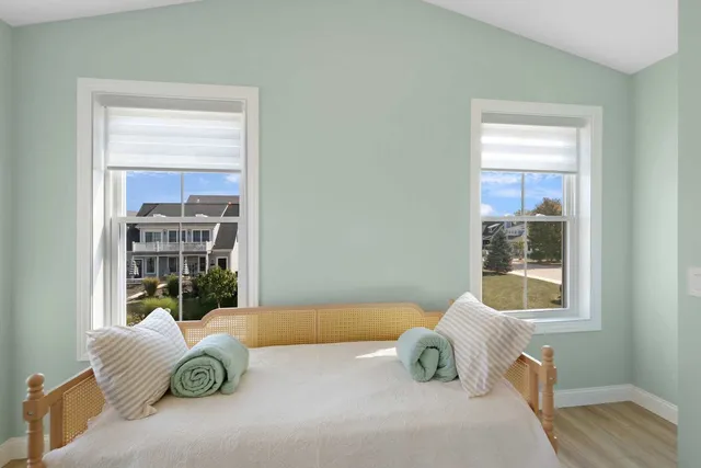 a bedroom with a bed and window