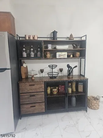 a view of workspace with stainless steel appliances cabinets