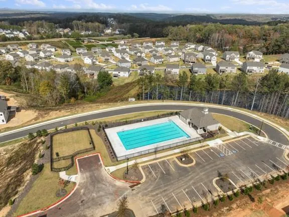 a view of a swimming pool with a lake view