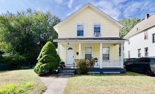 156 Allen Street Springfield, MA 01108 - Photo 1 of 31 a view of a house with a yard and plants