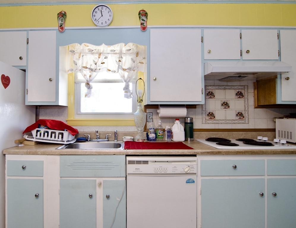 156 Allen Street Springfield, MA 01108 - Photo 12 of 31 a kitchen with stainless steel appliances cabinets and a window