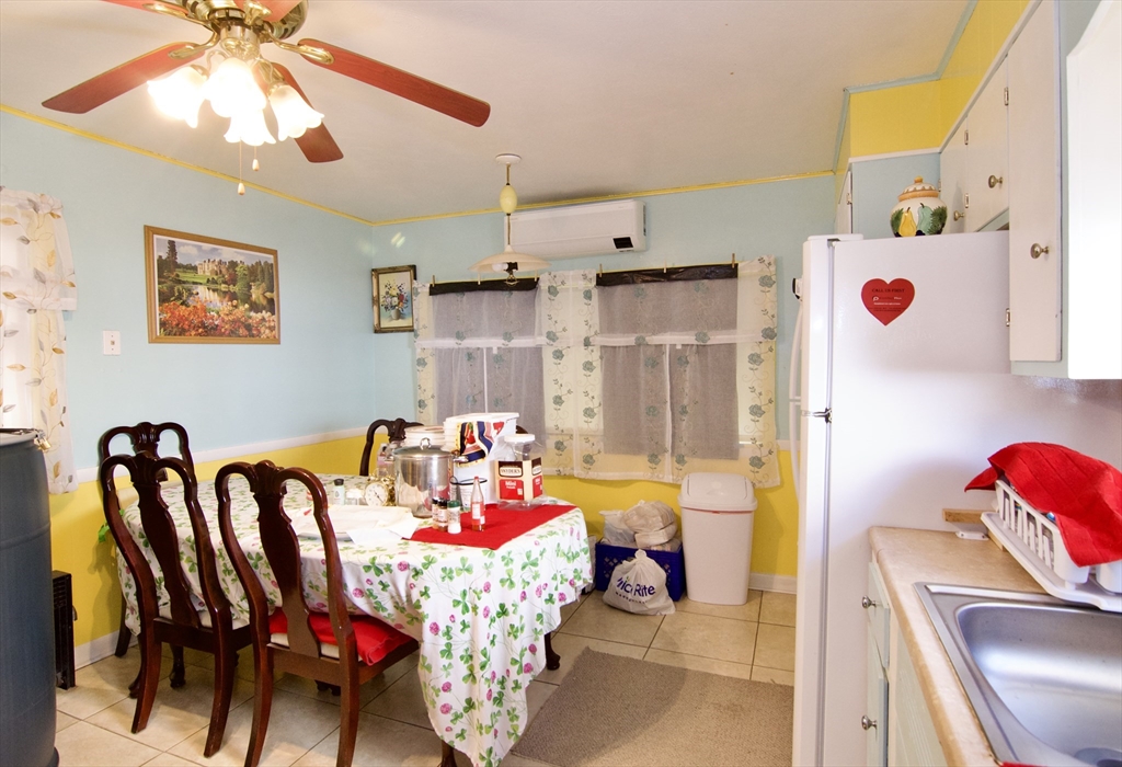 156 Allen Street Springfield, MA 01108 - Photo 14 of 31 a playing dining room with furniture and a chandelier fan