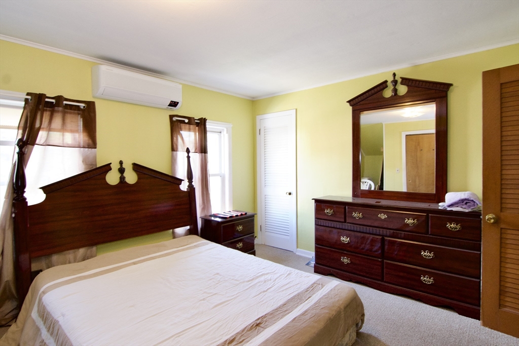 156 Allen Street Springfield, MA 01108 - Photo 20 of 31 a bedroom with a bed and a dresser