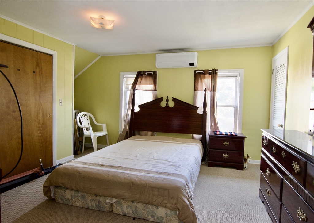 156 Allen Street Springfield, MA 01108 - Photo 21 of 31 a bedroom with a bed and dresser