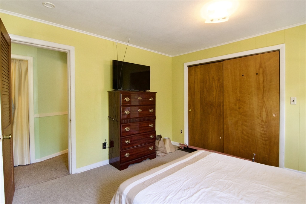 156 Allen Street Springfield, MA 01108 - Photo 23 of 31 a bedroom with a bed and furniture