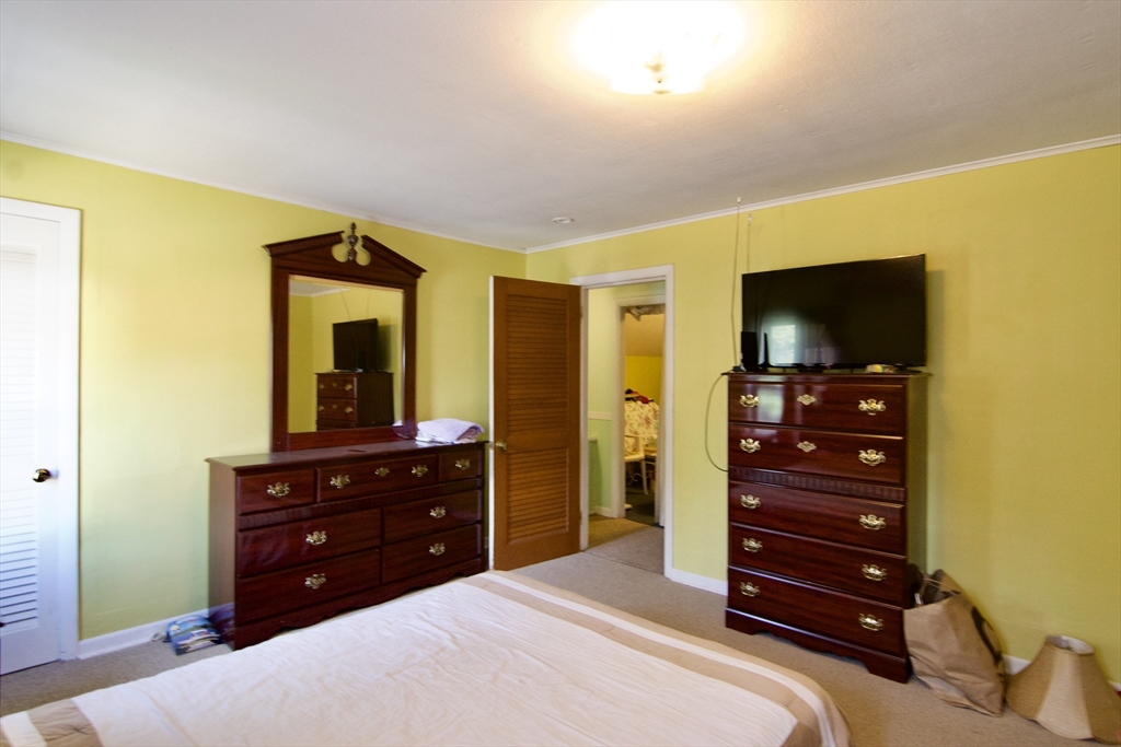156 Allen Street Springfield, MA 01108 - Photo 24 of 31 a bedroom with a bed and a television