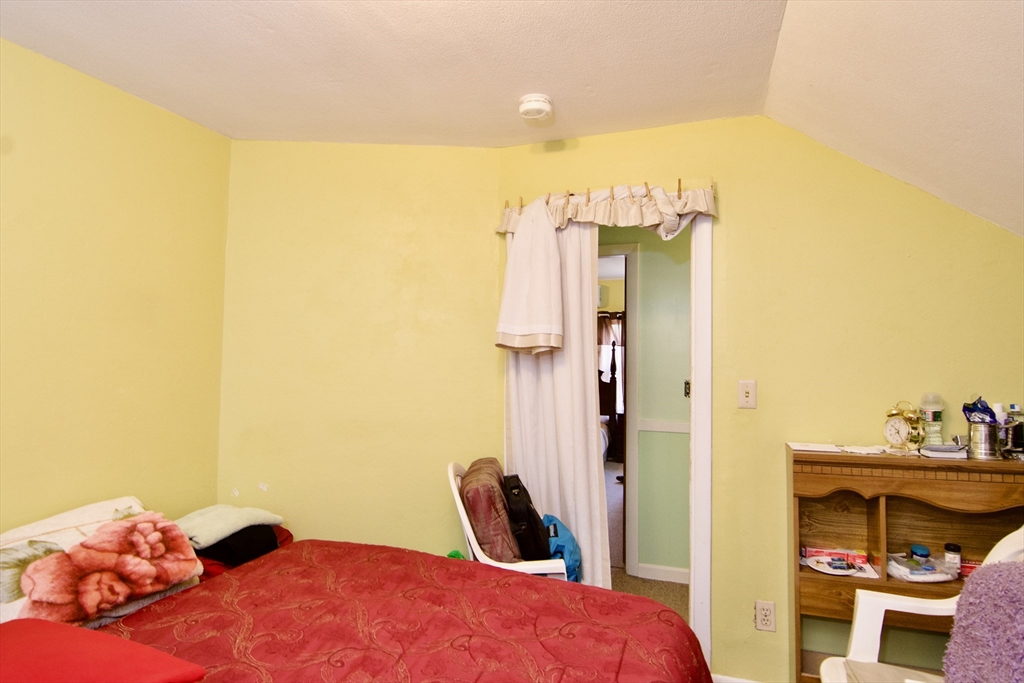 156 Allen Street Springfield, MA 01108 - Photo 28 of 31 a bedroom with a bed and a closet