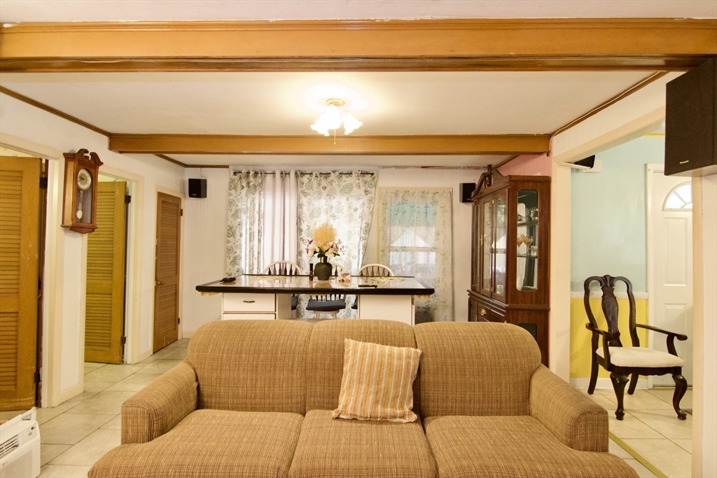 156 Allen Street Springfield, MA 01108 - Photo 7 of 31 a living room with furniture and a large window