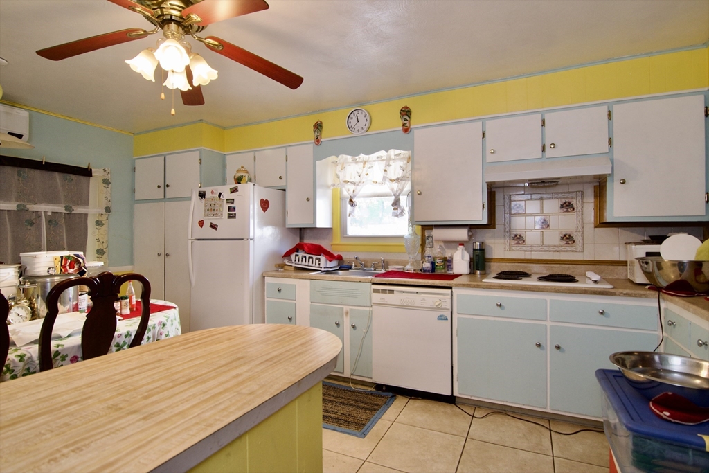156 Allen Street Springfield, MA 01108 - Photo 10 of 31 a kitchen that has a lot of cabinets in it and appliances