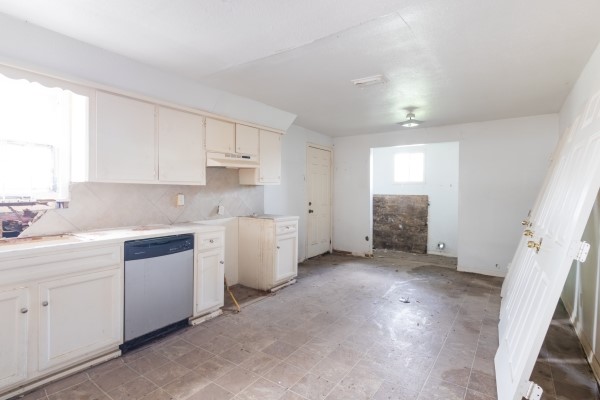 7973 Ritz Street Houston, TX 77028 - Photo 15 of 21 a kitchen with cabinets appliances and a window