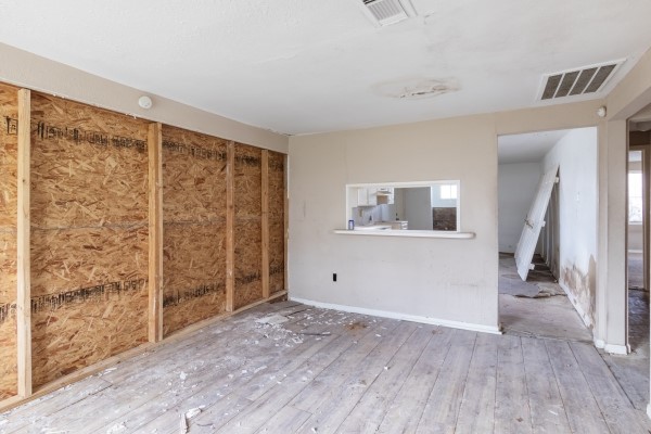 7973 Ritz Street Houston, TX 77028 - Photo 17 of 21 wooden floor in an empty room with a window