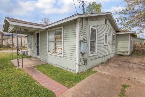 7973 Ritz Street Houston, TX 77028 - Photo 2 of 21 a front view of a house with a yard