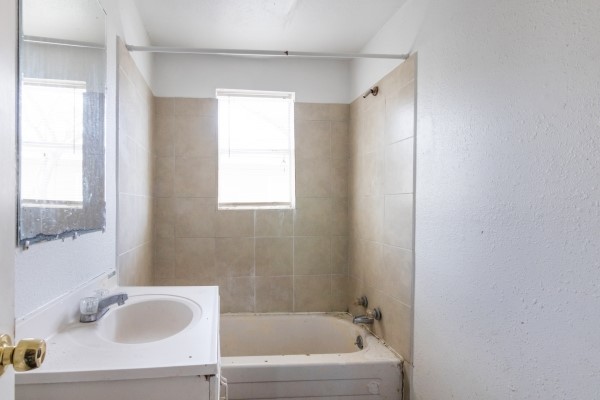 7973 Ritz Street Houston, TX 77028 - Photo 9 of 21 a bathroom with a tub and a sink
