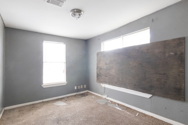 7973 Ritz Street Houston, TX 77028 - Photo 10 of 21 a view of an empty room with a window