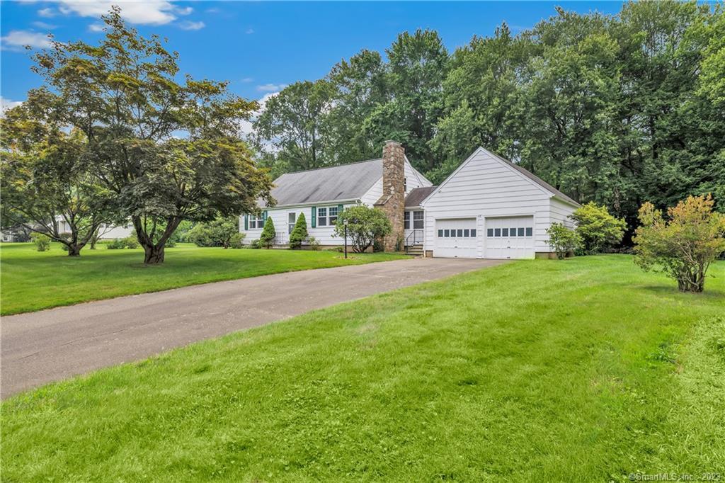 380 Walnut Tree Hill Road Shelton, CT 06484 - Photo 1 of 1 a front view of a house with a yard