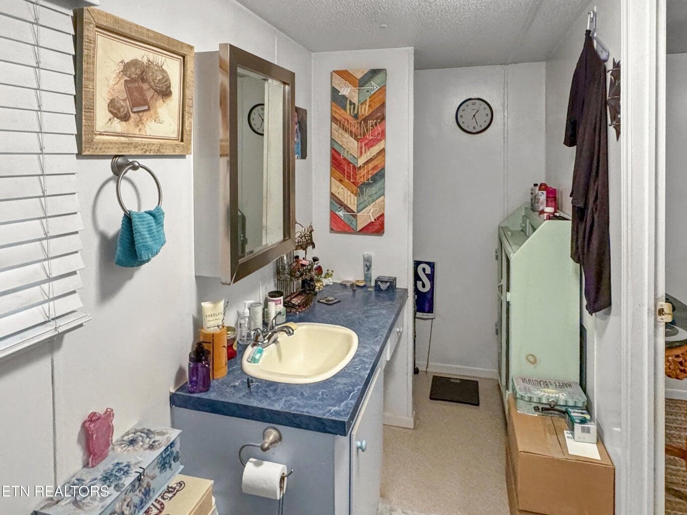 160 Casey Road Harriman, TN 37748 - Photo 13 of 30 a bathroom with a granite countertop sink and a mirror