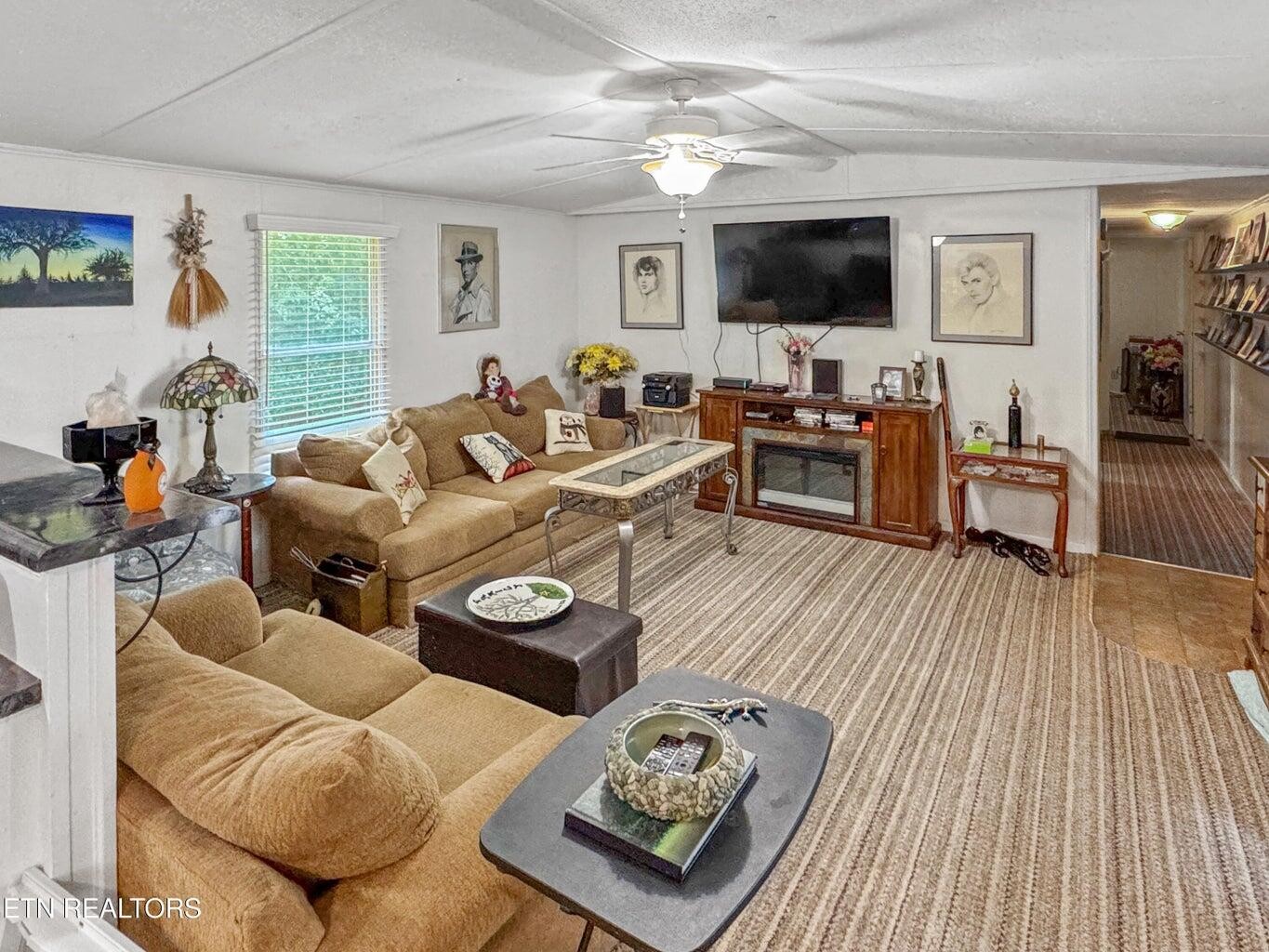 160 Casey Road Harriman, TN 37748 - Photo 15 of 30 a living room with furniture and a flat screen tv
