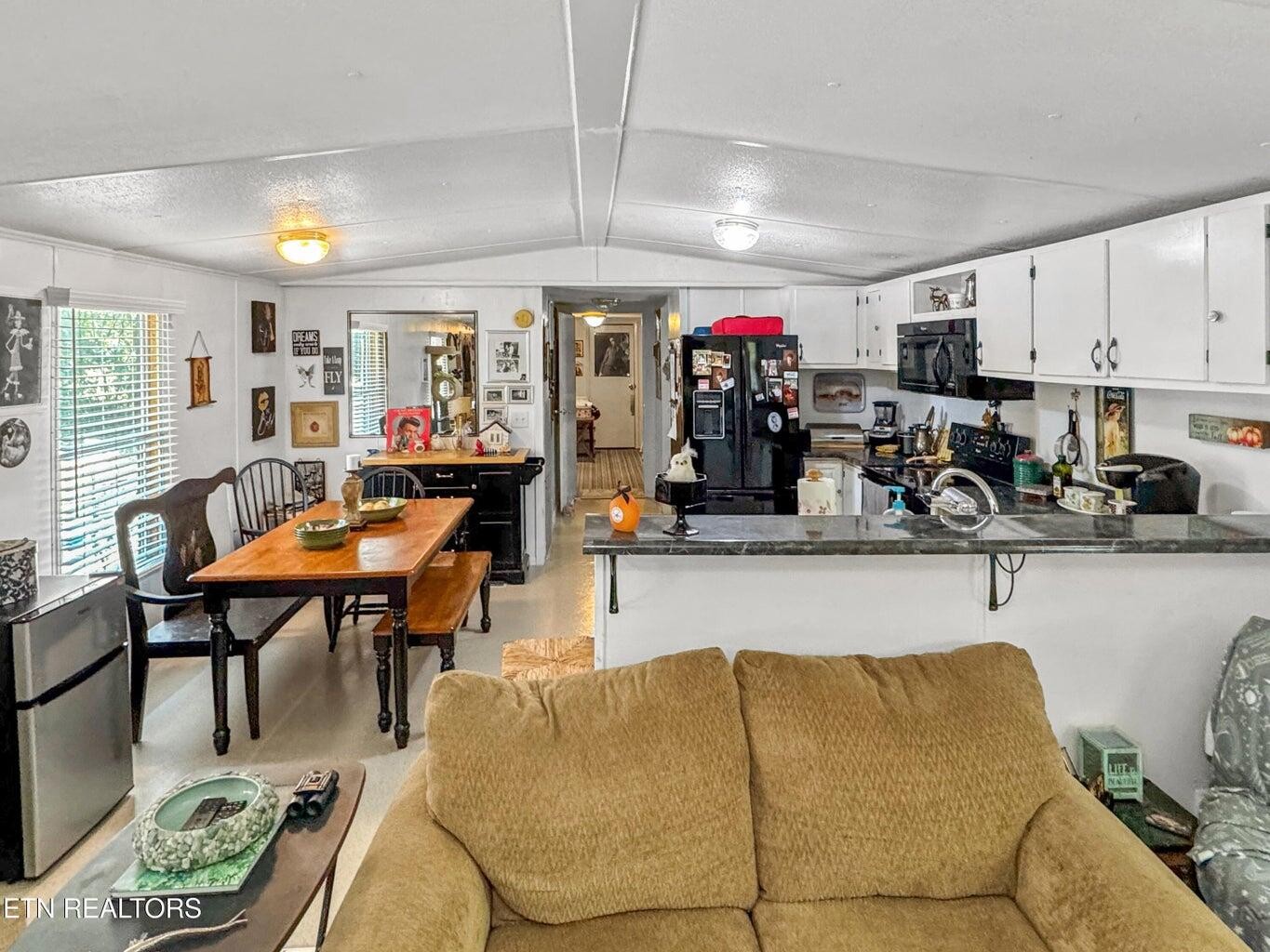 160 Casey Road Harriman, TN 37748 - Photo 5 of 30 a living room with furniture a rug and white walls