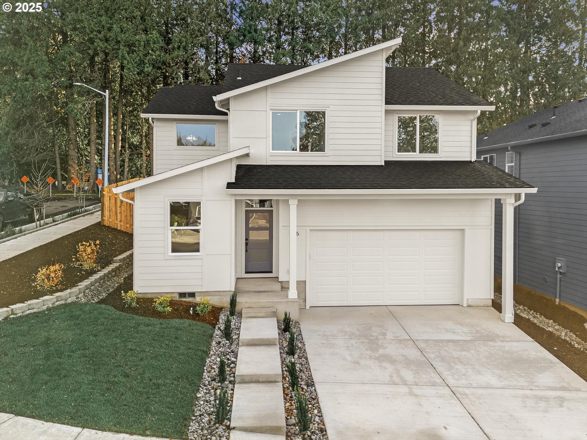 296 Southwest Mawrcrest Avenue Gresham, OR 97030 - Photo 1 of 35 a front view of a house with a yard