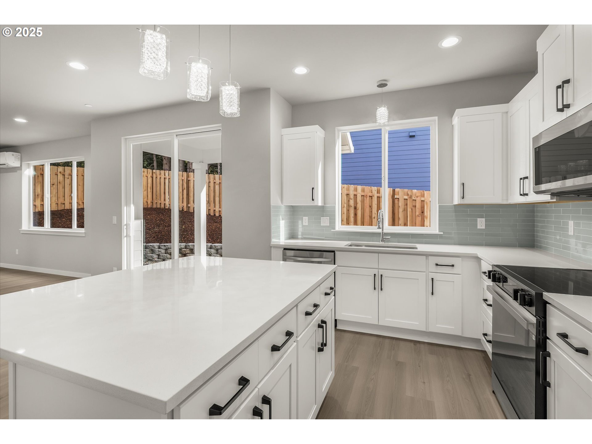 296 Southwest Mawrcrest Avenue Gresham, OR 97030 - Photo 13 of 35 a kitchen that has a sink a stove and window