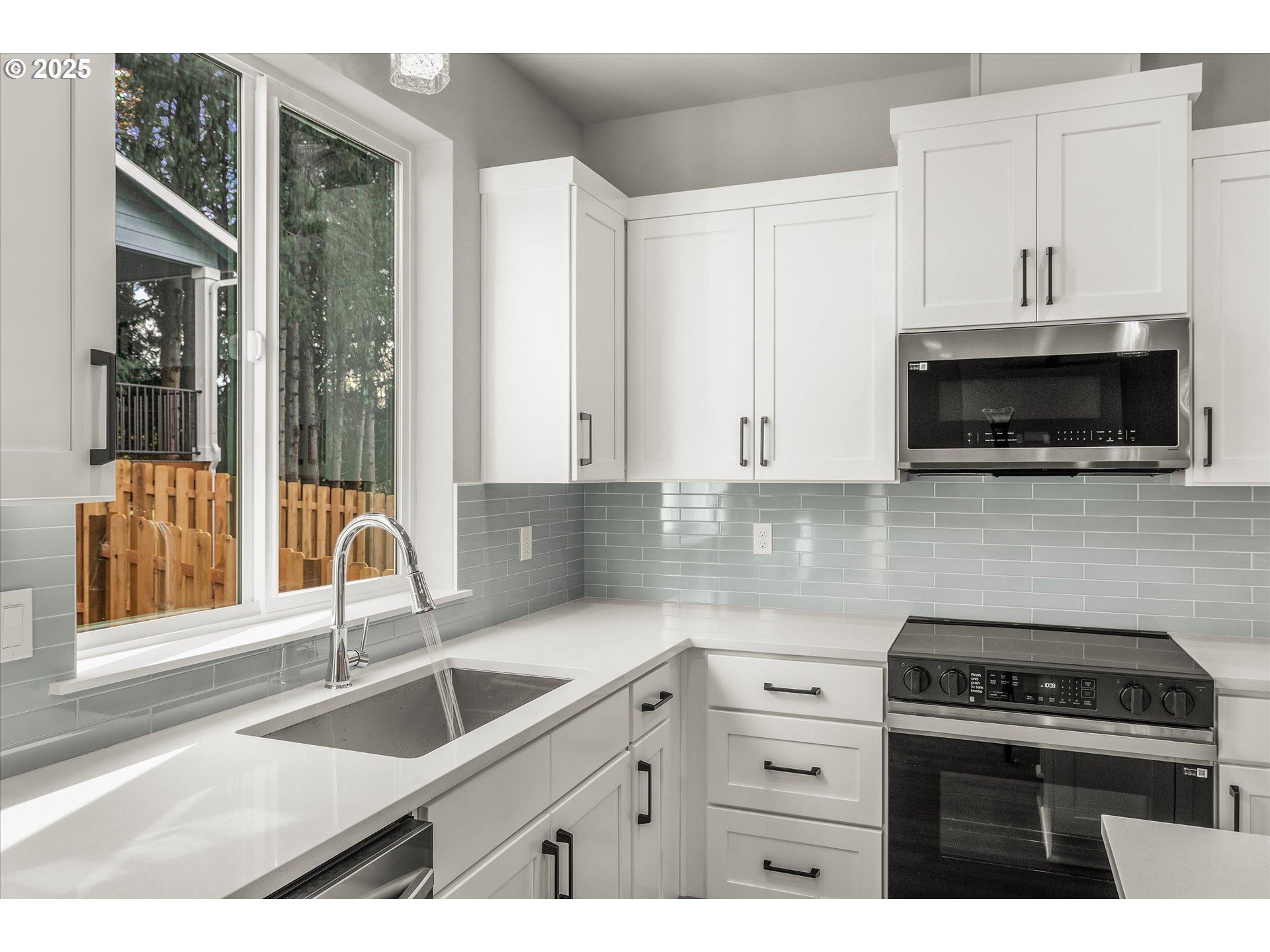 296 Southwest Mawrcrest Avenue Gresham, OR 97030 - Photo 14 of 35 a kitchen with stainless steel appliances granite countertop a sink stove and cabinets
