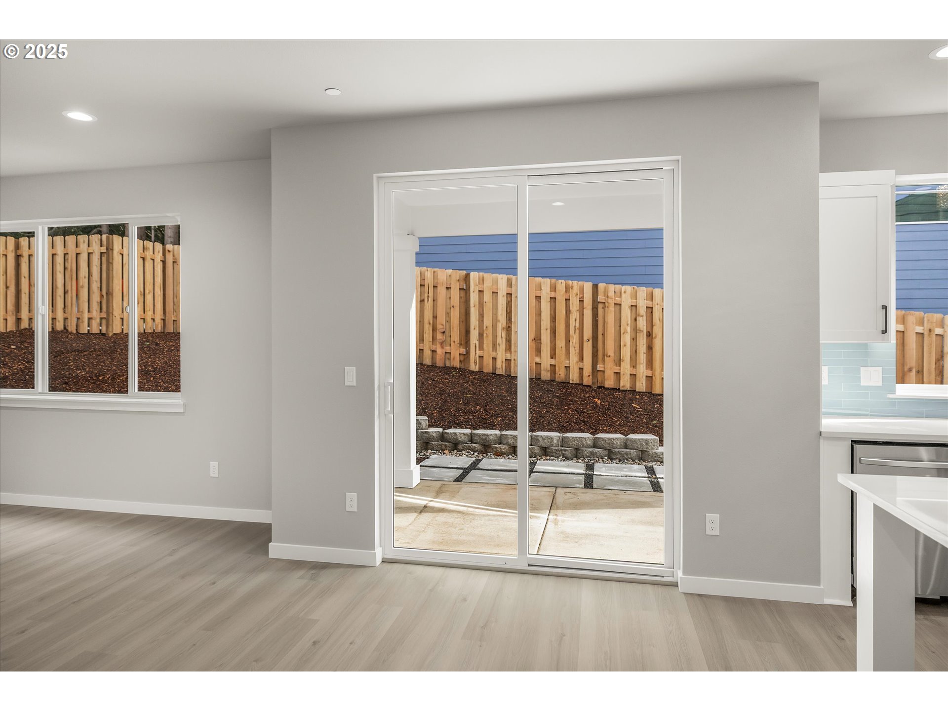 296 Southwest Mawrcrest Avenue Gresham, OR 97030 - Photo 15 of 35 a view of an empty room with wooden floor and a window