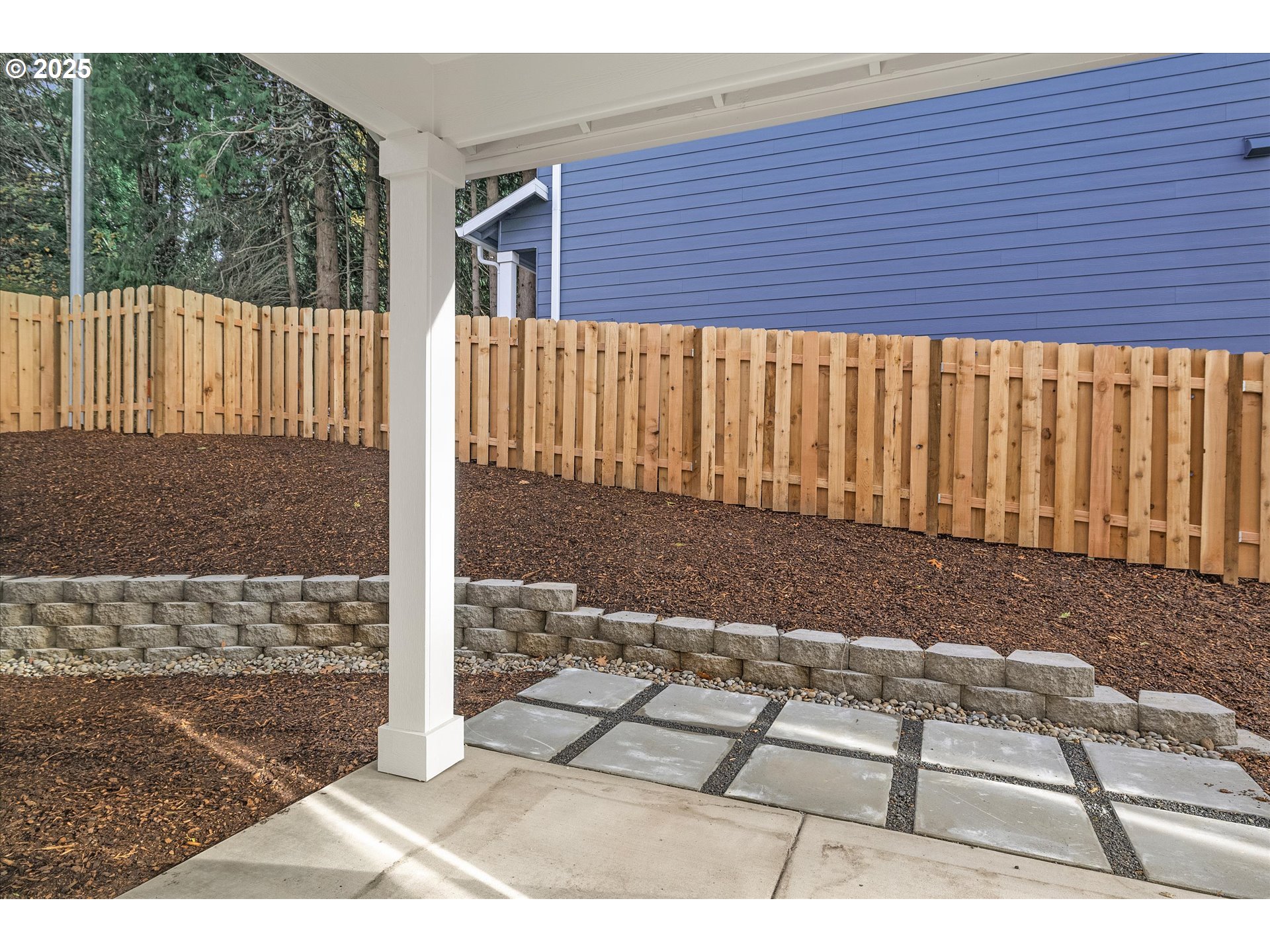 296 Southwest Mawrcrest Avenue Gresham, OR 97030 - Photo 16 of 35 a view of a backyard with a wooden fence