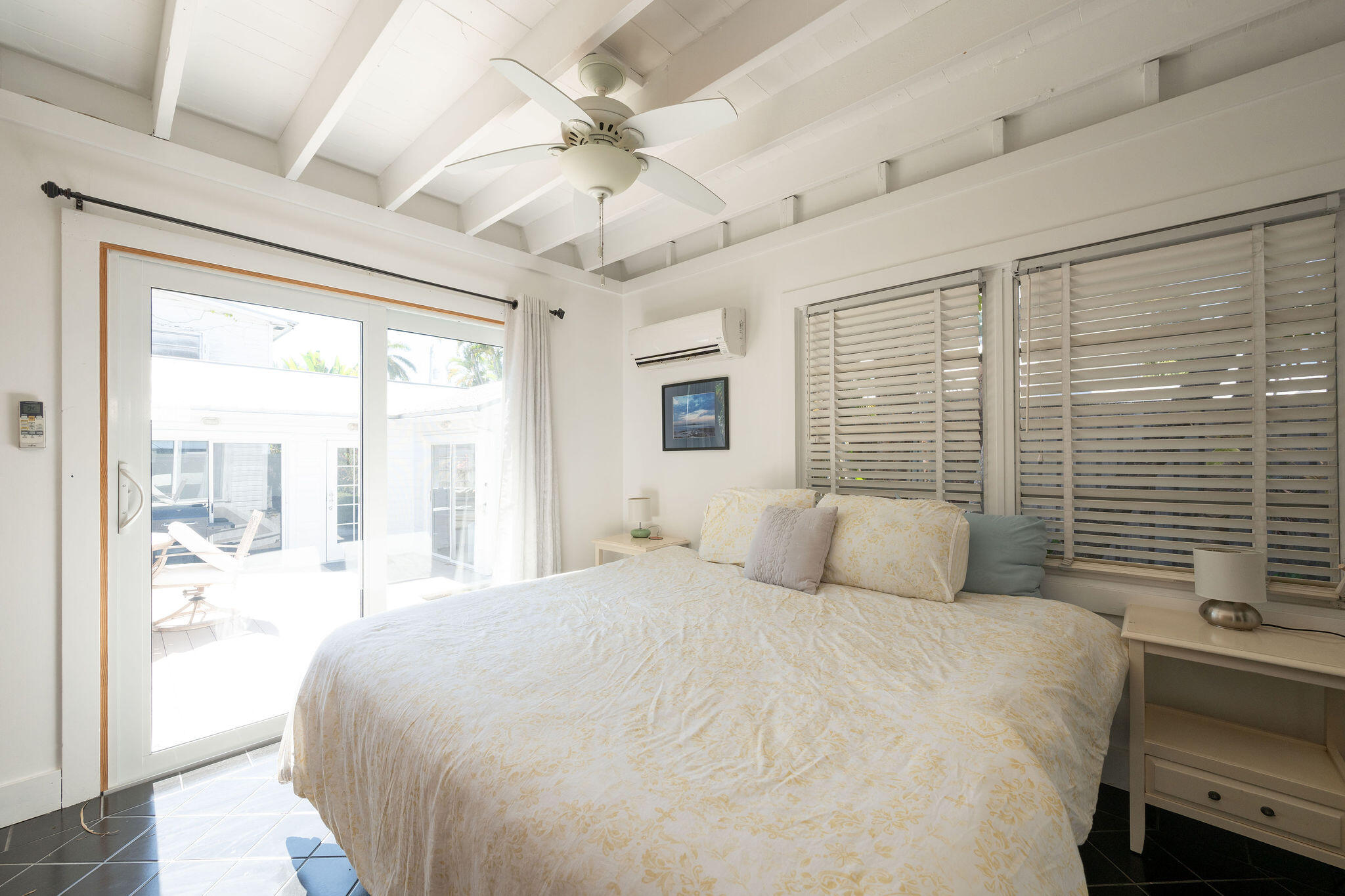 912 James Street, Unit 2 Key West, FL 33040 - Photo 12 of 25 a bedroom with a large bed and a window