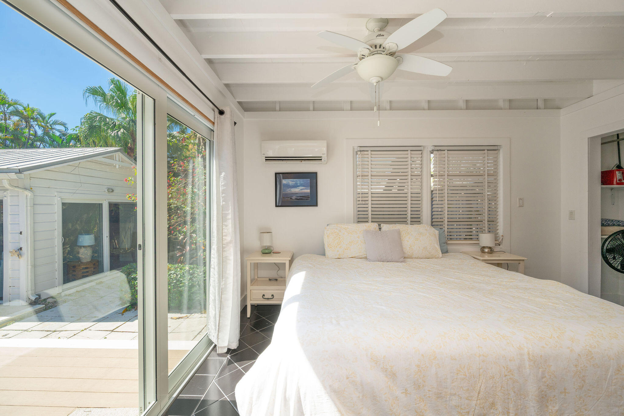 912 James Street, Unit 2 Key West, FL 33040 - Photo 15 of 25 a bedroom with a large bed and a chandelier